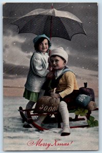 1912 Christmas Children Sled Sack Of Coins Snow Winter Scene Antique Postcard