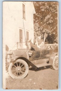 c1910's Postcard RPPC Photo Man Sleeping On Car Unposted Antique