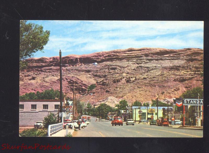 MOAB UTAH DOWNTOWN STREET SCENE 1950's CARS VINTAGE POSTCARD TRUCKS STORES