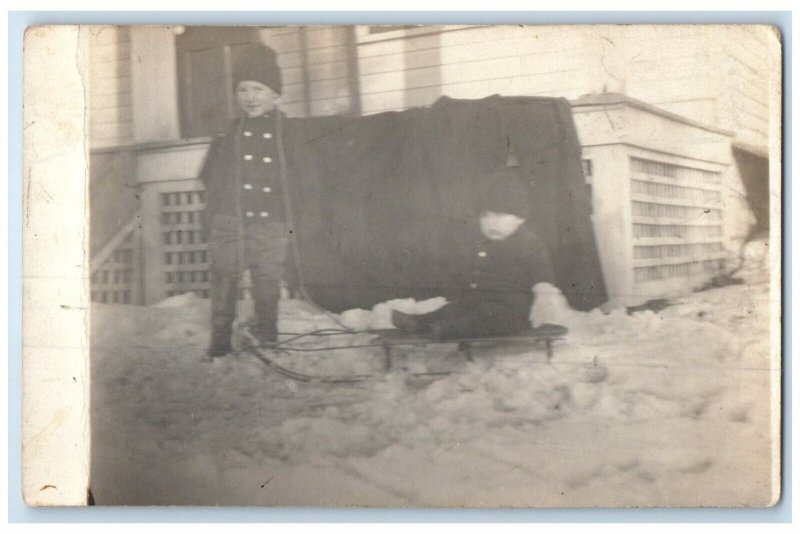 c1910's Little Boys Sledding Playing In Snow Winter RPPC Photo Antique Postcard