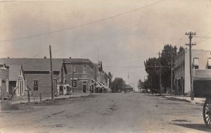 J32/ Eaton Colorado RPPC Postcard c1910 Main Satreet Stores Railroad Depot 26