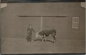 RPPC Farmer in Suit Roped Holstein Bull Barn Real Photo Postcard KRUXO