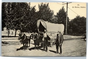 Oregon Trail: At Boise Idaho - men with ox and covered wagon postcard