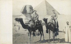 Egypt Cairo Pyramids and Sphynx camel mounted military men real photo postcard