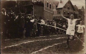 Running Race Man Crossing Finish Line - Europe - Real Photo Postcard c1910