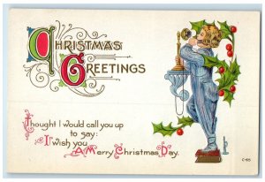 c1910s Christmas Greetings Boy Telephone Holly Berries Embossed Antique Postcard