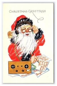 Santa Claus With Radio & Headphone Christmas Lists Embossed Postcard