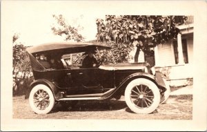 Real Photo Postcard Woman Behind The Wheel of an Automobile Outside of a House