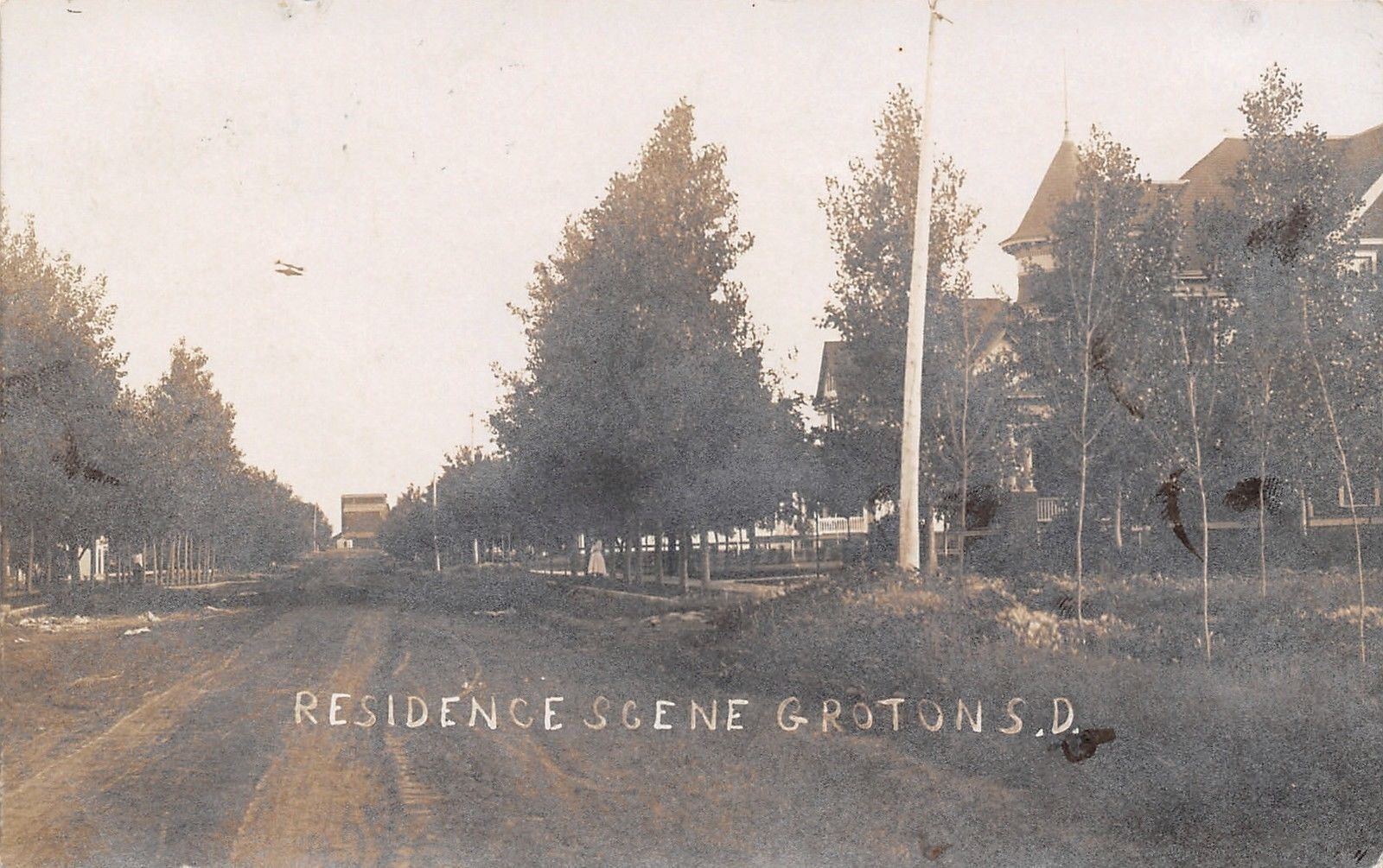 Groton South DakotaHomes Along Dirt RoadGirlGrain Elevator at End