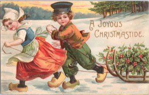 Charming 1909 Antique CHRISTMAS Postcard - Dutch Children Pulling Sled Embossed