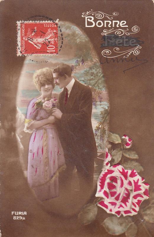 Lovely couple early greetings postcard