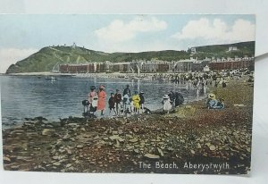 Family Enjoying a Paddle at the Beach Aberystwyth Wales Vintage Postcard 1910