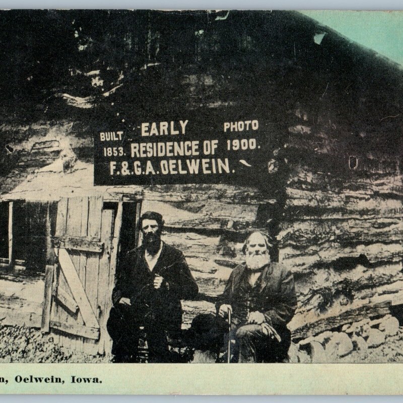 c1910s Oelwein, IA Pioneer Cabin 1853 Sign 1st House Residence Men Postcard A196