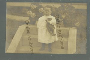 RPPC c1910 Little BOY posing with TEDDY BEAR Outside Flowers TOY TOYS Dress