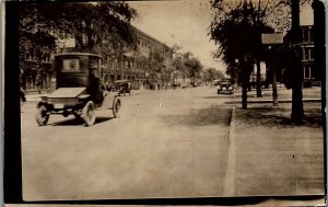 c1915 MAIN STREET VIEW PERIOD AUTOMOBILES AUTOS BUSINESSES RPPC POSTCARD 39-152