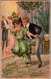 Vintage CHRISTMAS Postcard Boy Tries to Kiss Girl Under Mistletoe KJ1
