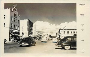 Postcard RPPC 1940 Coeur d'Alene Idaho Sherman Avenue autos Hotel 24-5490