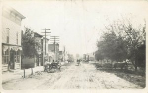 c1907 RPPC Postcard; Small Town Street Scene Horsedrawn Wagons Unknown US