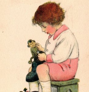 1920's Postcard Christmas Boy Playing With Toy Monkey Winch Back