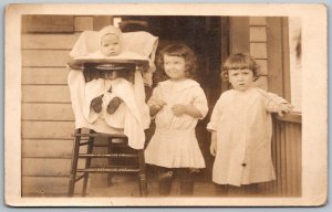 c1910 RPPC Real Photo Postcard Young Girls with Toddler In High Chair