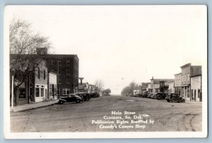 Canistota SD Postcard RPPC Photo Main Street Hotel Cars Dirt Road c1940's