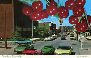 Postcard View of Old Cars lining Front Street in Traverse, MI.           N4