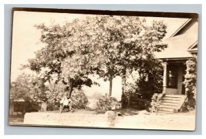 Vintage 1914 RPPC Postcard -  Man sits under his favorite tree Suburban Home