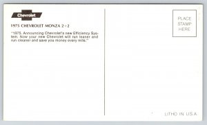 Automobile~White 1975 Chevrolet Monza 2+2 Hatchback~Blue Background~Postcard