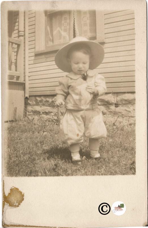 Real Photograph Postcard Baby Boy or Girl dressed in Pants and Coat