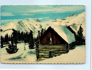 Postcard - A rustic cabin high in the solitude of the mighty Rockies