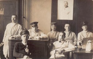 GERMAN WW1 SOLDIERS SITTING AT TABLE DRINKING-1917 FELDPOST PHOTO POSTCARD