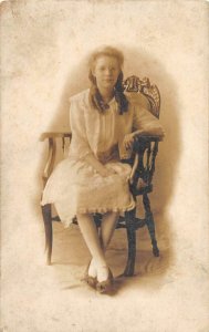 RPPC YOUNG WOMAN WITH GLASSES IN CHAIR AGNES BUTLER REAL PHOTO POSTCARD c. 1910