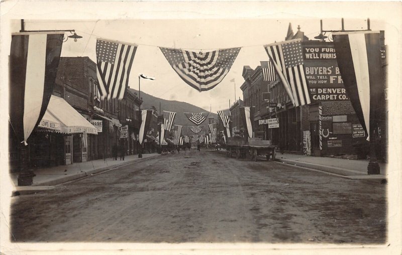 F40/ Salida Colorado RPPC Postcard c1910 Patriotic Stores Wagon