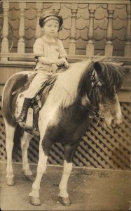 Little Boy on Pon y US Navy sailors Cap c1920 Real Photo Postcard