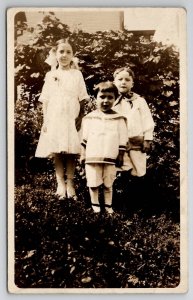 RPPC Children Girl and Boys in the Yard for Photo c1910 Postcard I28