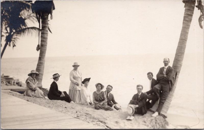 Family Group Portrait Ocean Palm Trees Unknown Loc Real Photo Postcard E30