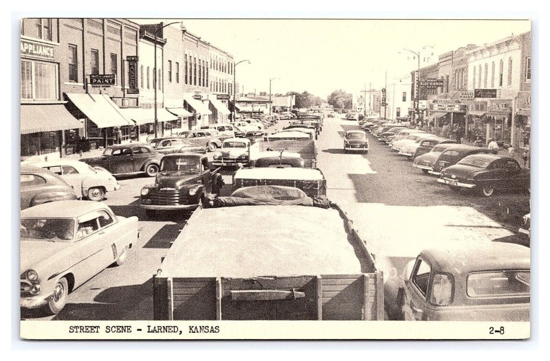 Postcard Street Scene Larned Kansas Old Cars Wheat Trucks Storefronts & Signs
