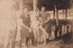 RPPC Postcard Family Man Woman Girl Old Bathing Suits Beach Scene