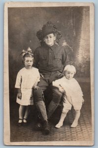 WWI Postcard RPPC Photo US Army Soldier And Children Studio c1910's Antique