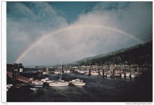 Rainbow overshadowing Queen Charlotte City, Government Wharf, British Columbi...