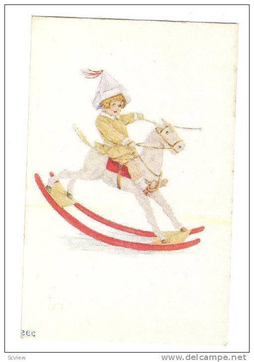 Boy riding toy rocking horse, 10-20s