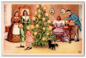 c1910's Christmas Tree Candles Girl Playing Piano Childrens Dog Sweden Postcard 