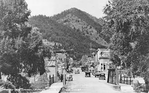 Idaho Springs CO Miner Street Storefronts Old Cars Iron Bridge RPPC