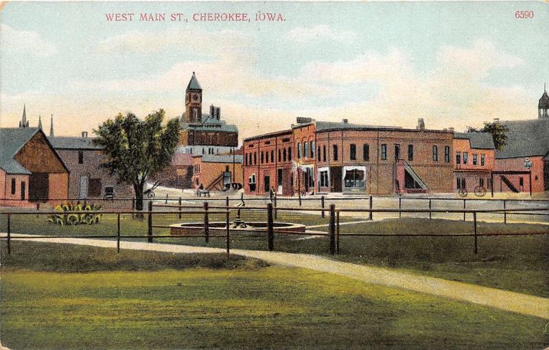 Cherokee Iowa~West Main Street~Railroad Crossing~Fenced in Fountain~c1910 Pc