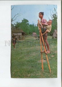 473243 South Vietnam Boys bamboo stits stilts Kontum Germany Postage Paid RPPC