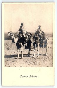 c1910 CAIRO EGYPT CAMEL DRIVERS IN DESERT PHOTO RPPC POSTCARD P504