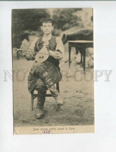 472860 Greece Crete local boy playing a musical instrument Vintage postcard