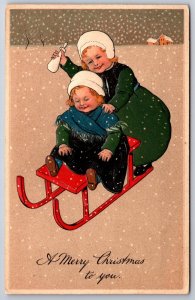 Marie Flatscher PFB Christmas~Girl Pushes Baby Sister On Red Sled In Snow~#6211