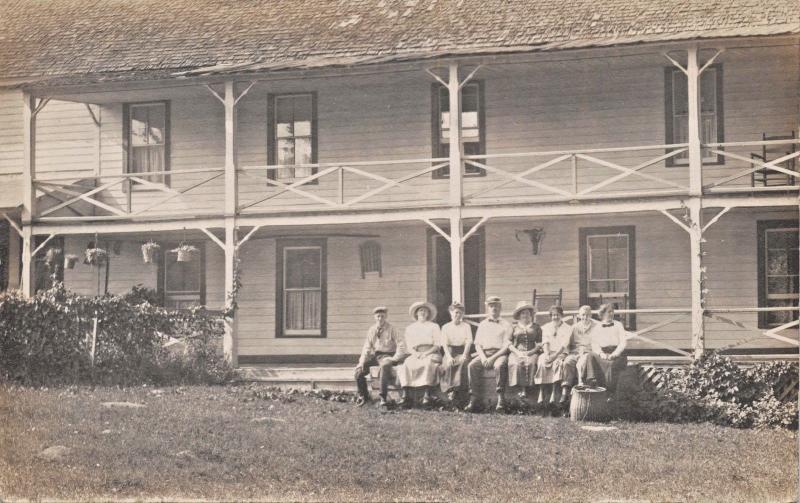 MULTI-GEN FAMILY~DBL PORCH LARGE HOUSE~WICKER BASKET~REAL PHOTO POSTCARD 1910s