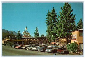 c1960 Exterior View Lucky Lodge Motel Cars South Lake Tahoe California Postcard